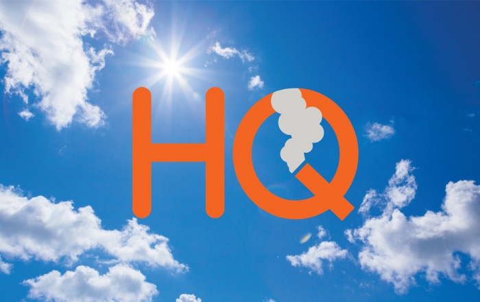The logo for Happy Quitter UK against a blue sky.